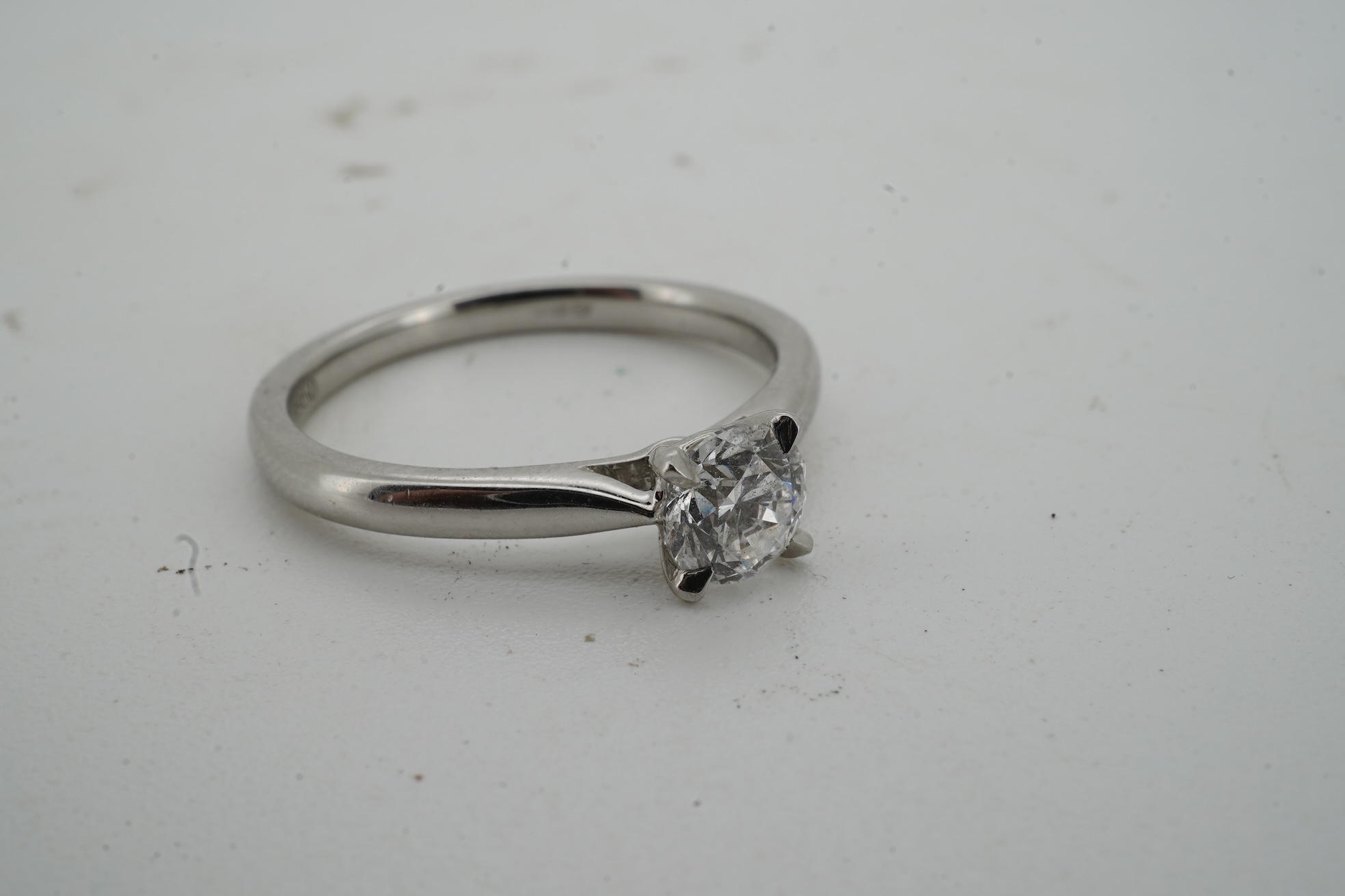 A diamond ring, claw-set with a brilliant-cut diamond weighing approximately 0.55 carats, mounted in platinum, size L1/2, British hallmarks, gross weight approximately 4 grams
